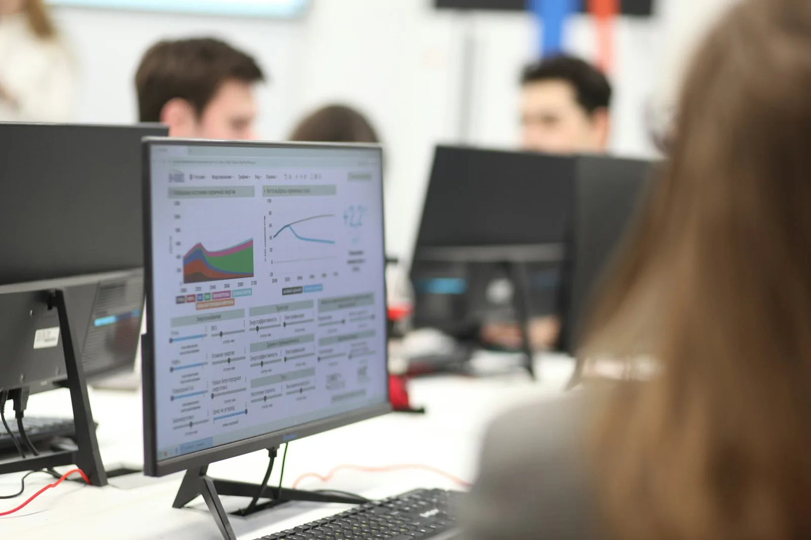 A team reviewing performance on screen