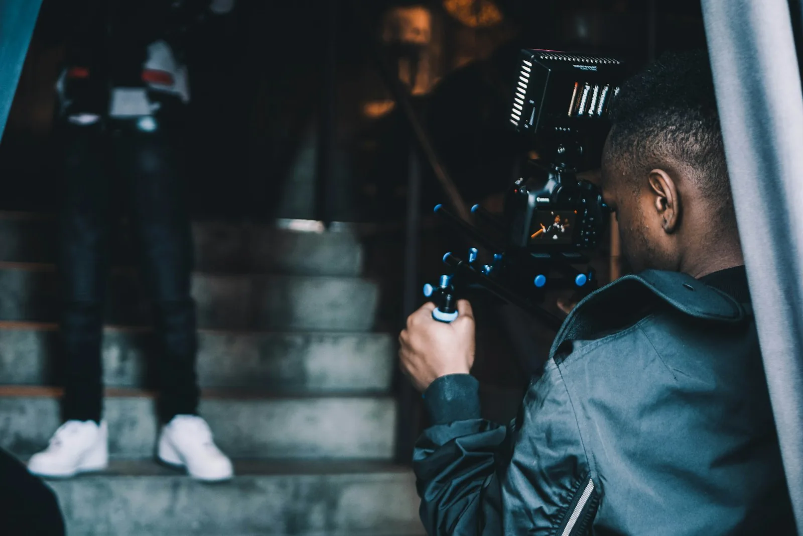A videographer filming on location