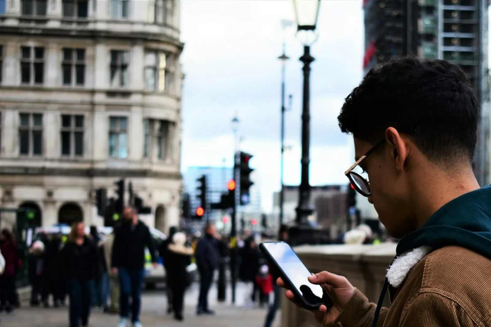 Someone searching on a phone out on the street