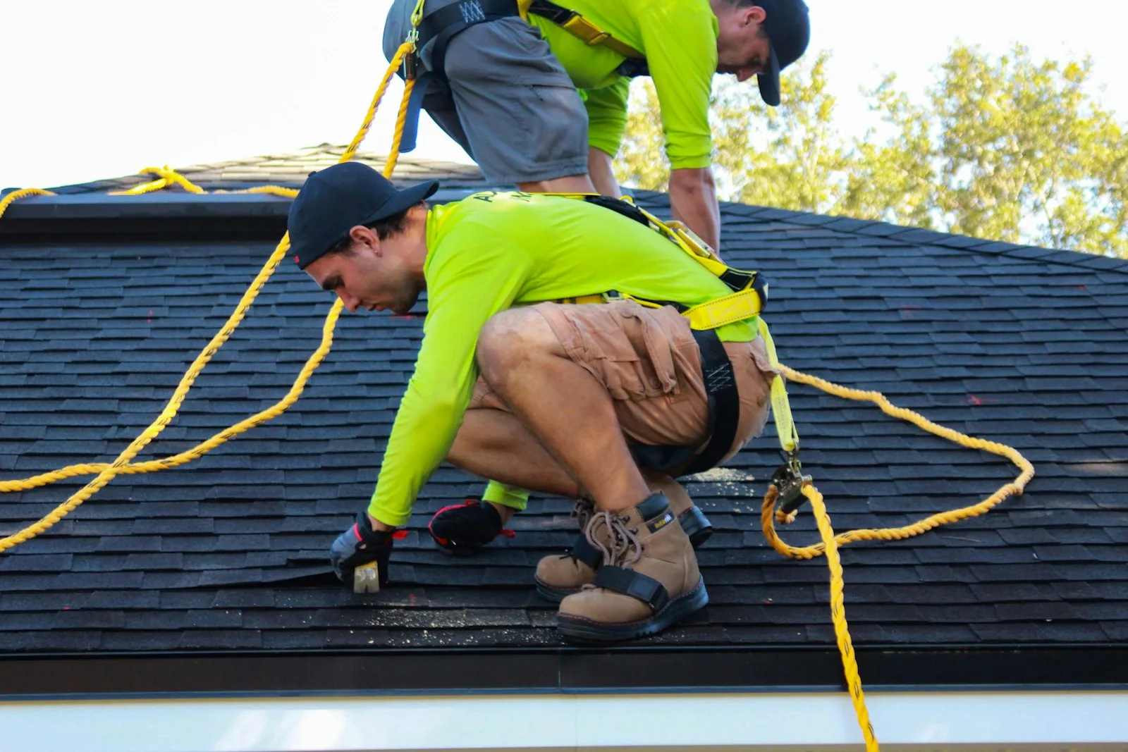 Roofers working on a residential roof